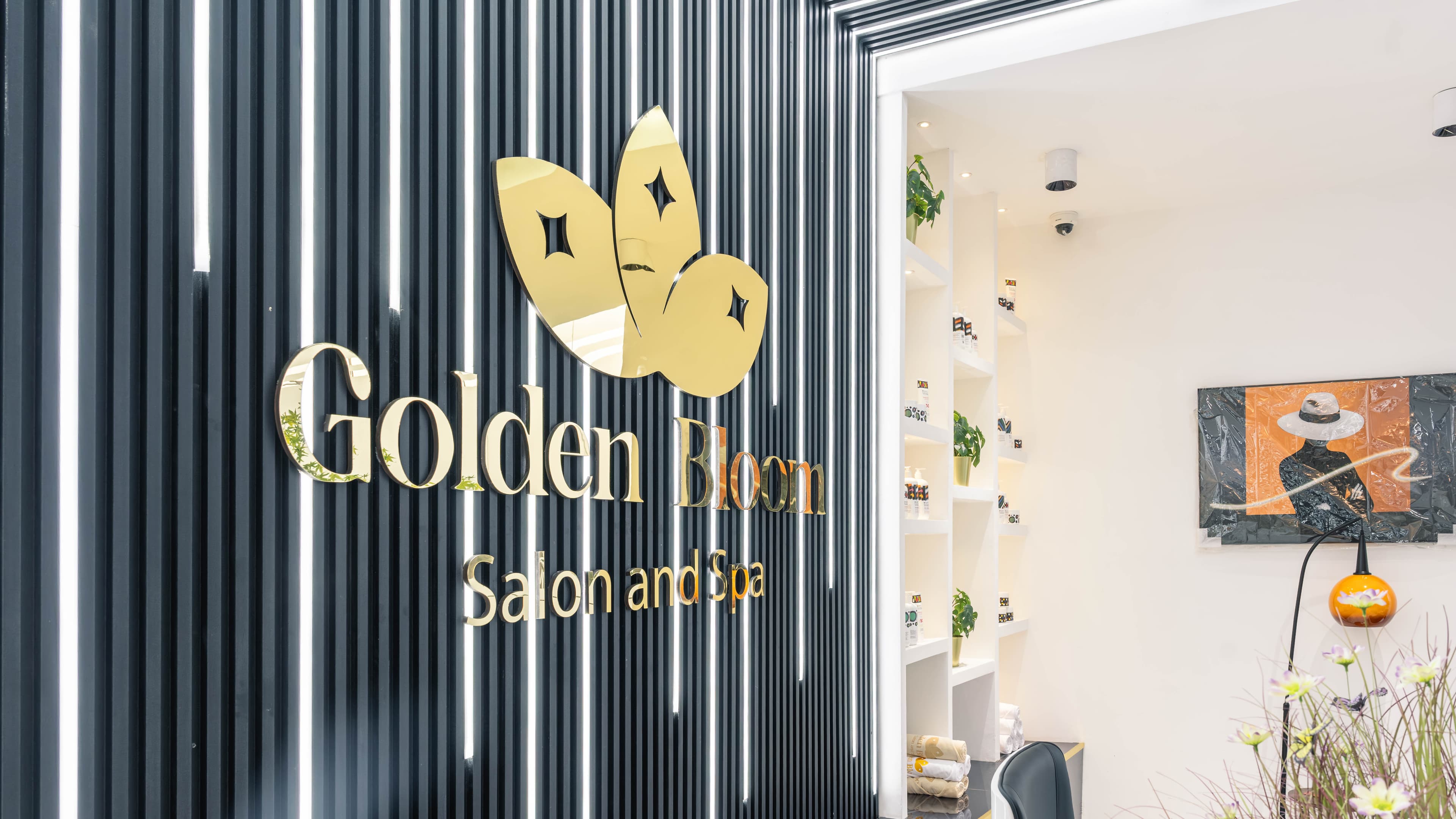 Golden Bloom logo wall at reception